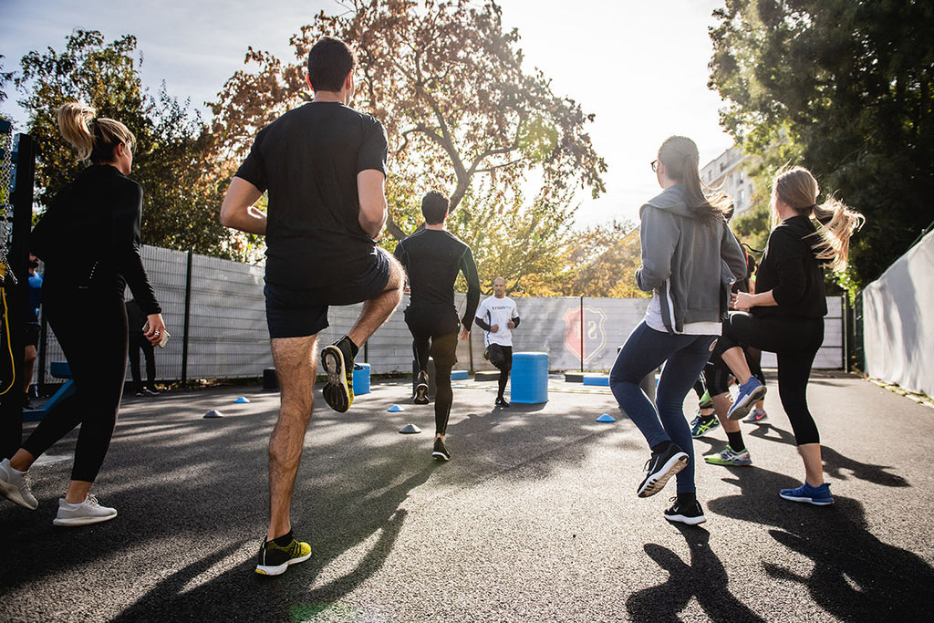 Photograph of a fitness instructor and 6 attendees 
